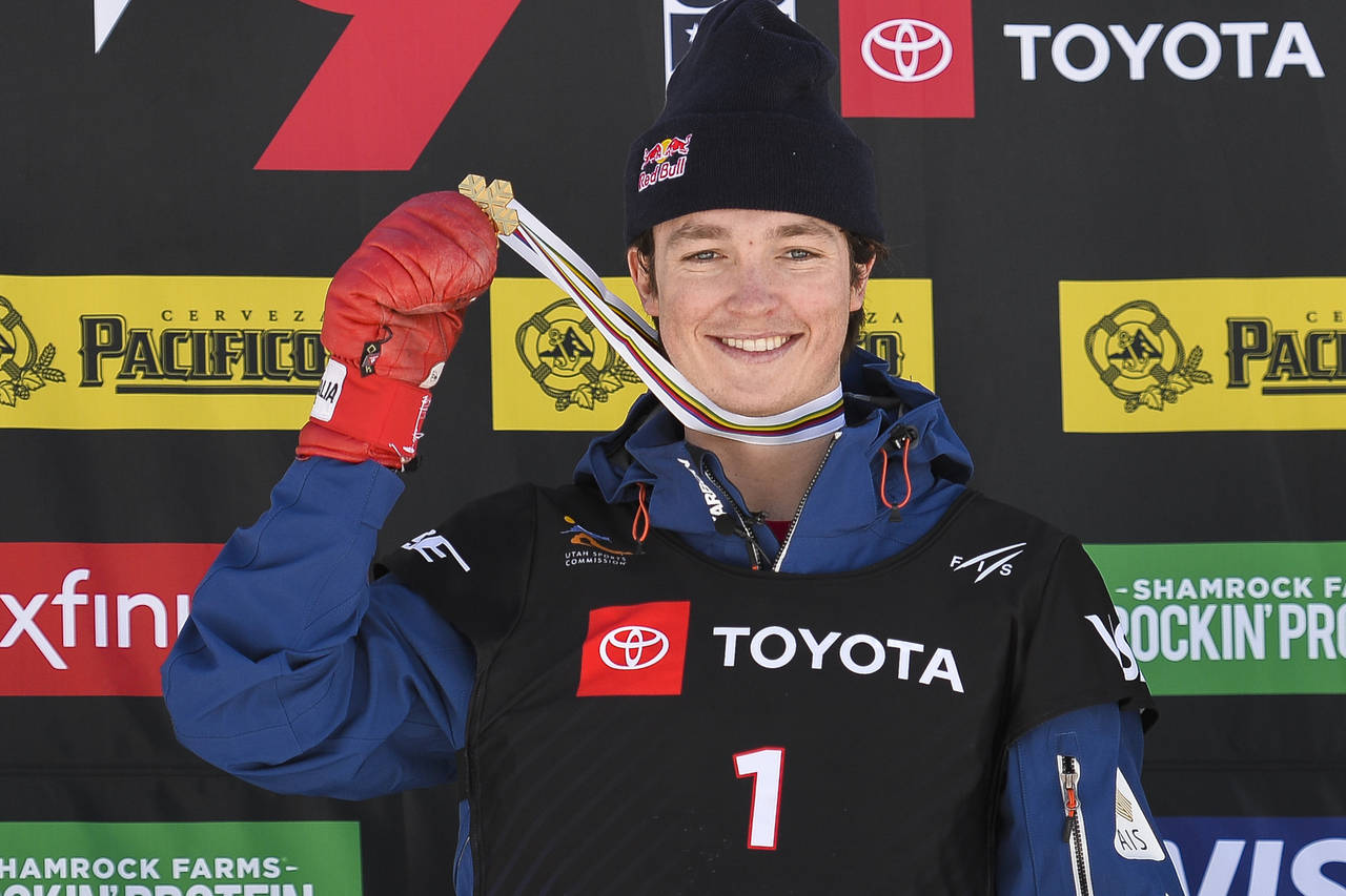 FILE - Gold medalist Scotty James of Australia celebrates after winning the men's snowboard halfpip...