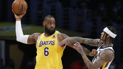 Los Angeles Lakers forward LeBron James (6) is defended by Utah Jazz guard Jordan Clarkson, right, ...