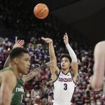 
              Gonzaga guard Andrew Nembhard (3) shoots during the first half of the team's NCAA college basketball game against San Francisco, Thursday, Jan. 20, 2022, in Spokane, Wash. (AP Photo/Young Kwak)
            