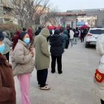 
              Residents line up for mass coronavirus tests in Huaxian County in central China's Henan Province, Friday, Jan. 14, 2022. China further tightened its anti-pandemic measures in Beijing and across the country on Friday as scattered outbreaks continued ahead of the opening of the Winter Olympics in a little over two weeks. (Chinatopix via AP)
            