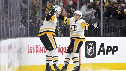 Pittsburgh Penguins center Teddy Blueger, right, celebrates his goal against the Vegas Golden Knigh...