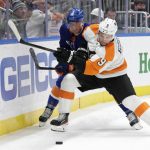 
              New York Islanders center Brock Nelson (29) and Philadelphia Flyers defenseman Ivan Provorov (9) fight for the puck during the second period of an NHL hockey game, Tuesday, Jan. 25, 2022, in Elmont, N.Y. (AP Photo/Corey Sipkin).
            