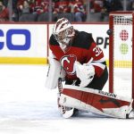 
              A shot by Carolina Hurricanes left wing Josh Leivo (not shown) gets by New Jersey Devils goaltender Jon Gillies (32) for a goal during the second period of an NHL hockey game, Saturday, Jan. 22, 2022, in Newark, N.J. (AP Photo/Noah K. Murray)
            