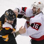 
              Ottawa Senators' Austin Watson (16) gets a punch in during a fight with Pittsburgh Penguins' Brian Boyle during the first period of an NHL hockey game in Pittsburgh, Thursday, Jan. 20, 2022. (AP Photo/Gene J. Puskar)
            