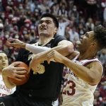 
              Purdue's Zach Edey (15) is fouled by Indiana's Trayce Jackson-Davis (23) during the first half of an NCAA college basketball game, Thursday, Jan. 20, 2022, in Bloomington, Ind. (Darron Cummings)
            