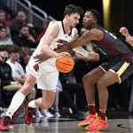 
              Louisville forward Matt Cross, left, tries to get around Boston College forward Gianni Thompson during the first half of an NCAA college basketball game in Louisville, Ky., Wednesday, Jan. 19, 2022. (AP Photo/Timothy D. Easley)
            