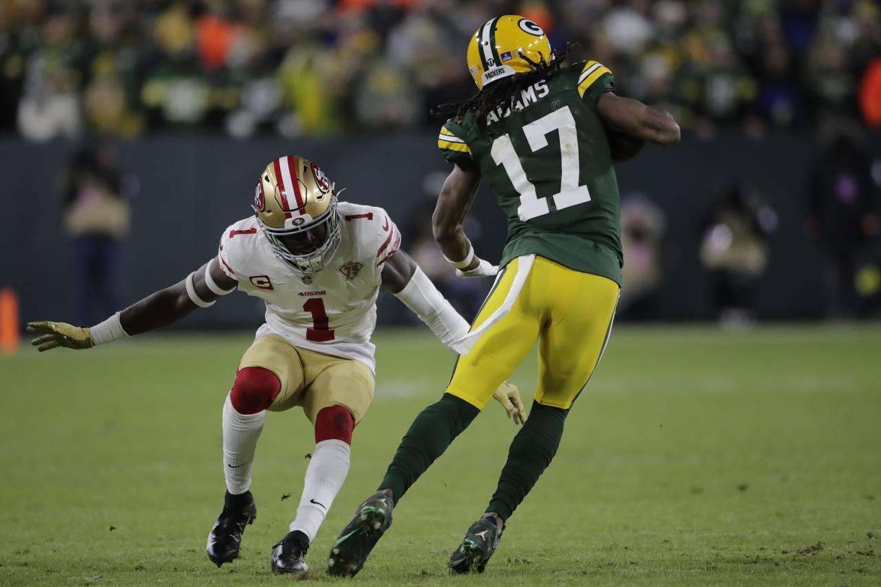 Green Bay Packers' Davante Adams tries to get past San Francisco 49ers' Jimmie Ward during the firs...