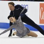 
              Madison Chock and Even Bates compete in the ice dance program during the U.S. Figure Skating Championships Saturday, Jan. 8, 2022, in Nashville, Tenn. (AP Photo/Mark Zaleski)
            