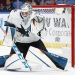 
              San Jose Sharks goaltender Adin Hill (33) makes a save during the first period of an NHL hockey game against the Buffalo Sabres, Thursday, Jan. 6, 2022, in Buffalo, N.Y. (AP Photo/Jeffrey T. Barnes)
            