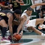 
              Florida State guard RayQuan Evans, left, and guard Isaiah Wong (2) go for the ball during the second half of an NCAA college basketball game, Saturday, Jan. 22, 2022, in Coral Gables, Fla. Florida State won 61-60. (AP Photo/Lynne Sladky)
            