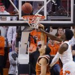 
              Texas forward Dylan Disu, left, goes up for a dunk but misses as Oklahoma State guard Bryce Williams, right, defends, in the second half of an NCAA college basketball game Saturday, Jan. 8, 2022, in Stillwater, Okla. (AP Photo/Sue Ogrocki)
            