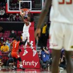 
              Maryland guard Hakim Hart, center, drops a dunk in front of Illinois Fighting guard Trent Frazier (1) during the first half of an NCAA college basketball game, Friday, Jan. 21, 2022, in College Park, Md. (AP Photo/Julio Cortez)
            