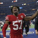 
              San Francisco 49ers outside linebacker Dre Greenlaw (57) celebrates after the 49ers defeated the Dallas Cowboys in an NFL wild-card playoff football game in Arlington, Texas, Sunday, Jan. 16, 2022. (AP Photo/Roger Steinman)
            