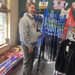 
              Mark Waechter, owner of Nordic Ultratune, a ski retail and repair shop in Winthrop, Washington, stands with a new batch of skis that arrived for the 2021-22 winter ski season. When COVID-19 hit in the winter of 2020, many escaped cabin fever by hitting the ski trails and Nordic skis quickly became the new toilet paper – they were hard to find and sold out in stores. The ski boom has continued as the pandemic makes winter outdoor recreation appealing, but climate change means its future is uncertain. (AP Photo/Martha Bellisle)
            
