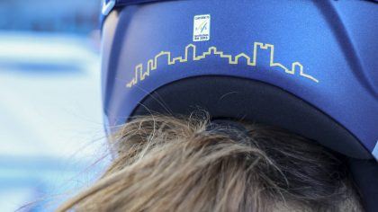Italy's Sofia Goggia sports Bergamo's skyline on the back of her racing helmet, in the finish area ...