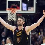 
              Cleveland Cavaliers' Kevin Love (0) reacts after hitting a 3-point shot in the first half of an NBA basketball game against the Milwaukee Bucks, Wednesday, Jan. 26, 2022, in Cleveland. (AP Photo/Tony Dejak)
            