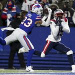 
              Buffalo Bills safety Micah Hyde (23) makes an interception against New England Patriots wide receiver Nelson Agholor (15) during the first half of an NFL wild-card playoff football game, Saturday, Jan. 15, 2022, in Orchard Park, N.Y. (AP Photo/Joshua Bessex)
            