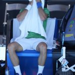 
              Defending men's champion Serbia's Novak Djokovic rests during a practice session on Margaret Court Arena ahead of the Australian Open tennis championship in Melbourne, Australia, Thursday, Jan. 13, 2022. AP Photo/Mark Baker)
            