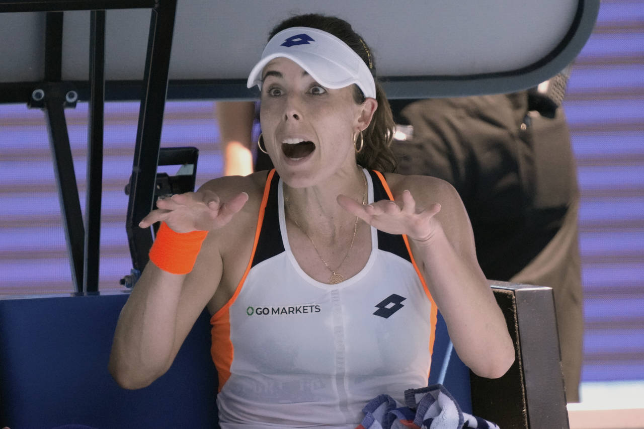 Alize Cornet of France reacts after losing the first set against Danielle Collins of the U.S. durin...
