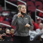 
              Wake Forest head coach Jennifer Hoover sends instructions in to her team during the first half of an NCAA college basketball game against Louisville in Louisville, Ky., Sunday, Jan. 23, 2022. (AP Photo/Timothy D. Easley)
            
