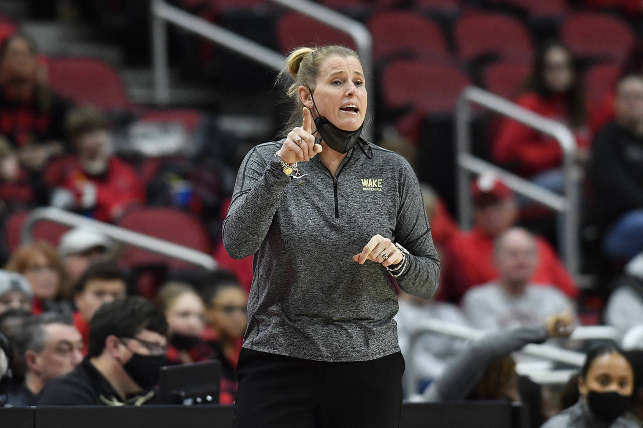 Wake Forest head coach Jennifer Hoover sends instructions in to her team during the first half of a...