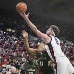 
              Gonzaga forward Drew Timme (2) shoots over San Francisco forward Patrick Tapé (11) during the first half of an NCAA college basketball game, Thursday, Jan. 20, 2022, in Spokane, Wash. (AP Photo/Young Kwak)
            