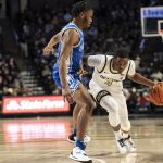 
              Wake Forest guard Daivien Williamson (4) drives past Duke guard Jeremy Roach during the first half of an NCAA college basketball game on Wednesday, Jan. 12, 2022, in Winston-Salem, N.C. (AP Photo/Matt Kelley)
            