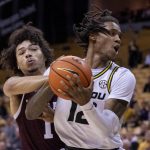 
              Texas A&M's Marcus Williams, left, tries to steal the ball from Missouri's DaJuan Gordon, right, during the second half of an NCAA college basketball game Saturday, Jan. 15, 2022, in Columbia, Mo. Texas A&M won 67-64. (AP Photo/L.G. Patterson)
            