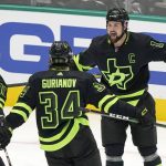 
              Dallas Stars left wing Jamie Benn (14) celebrates his goal with teammates Tyler Seguin (91) and Denis Gurianov (34) during the third period of the team's NHL hockey game against the Florida Panthers in Dallas, Thursday, Jan. 6, 2022. The Stars won 6-5 in a shootout. (AP Photo/LM Otero)
            