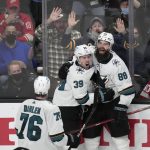 
              San Jose Sharks center Logan Couture (39) celebrates his with Brent Burns (88) and Jonathan Dahlen (76) after scoring a goal during overtime against the Detroit Red Wings of an NHL hockey game Tuesday, Jan. 11, 2022, in San Jose, Calif. The Sharks won 3-2 in overtime. (AP Photo/Tony Avelar)
            