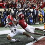 
              Georgia wide receiver Adonai Mitchell, left, catches the go-ahead touchdown against Alabama defensive back Khyree Jackson (6) to take a 19-18 lead in the fourth quarter of the College Football Playoff championship football game Monday, Jan. 10, 2022, in Indianapolis. (Curtis Compton/Atlanta Journal-Constitution via AP)
            