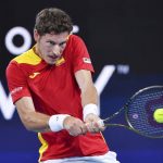 
              Pablo Carreno Busta of Spain makes a backhand return to Denis Shapovalov of Canada at the final match of the ATP Cup tennis tournament in Sydney, Sunday, Jan. 9, 2022. (Dean Lewins/AAP Image via AP)
            