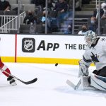 
              Detroit Red Wings left wing Tyler Bertuzzi (59) scores a goal past San Jose Sharks goaltender Adin Hill (33) during the second period of an NHL hockey game Tuesday, Jan. 11, 2022, in San Jose, Calif. (AP Photo/Tony Avelar)
            