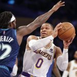 
              Los Angeles Lakers guard Russell Westbrook (0) looks to pass while defended by Minnesota Timberwolves guard Patrick Beverley (22) during the first half of an NBA basketball game in Los Angeles, Sunday, Jan. 2, 2022. (AP Photo/Ringo H.W. Chiu)
            