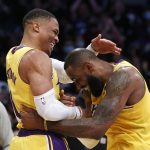 
              Los Angeles Lakers guard Russell Westbrook, left, is congratulated by forward LeBron James after scoring against the Utah Jazz during the second half of an NBA basketball game in Los Angeles, Monday, Jan. 17, 2022. The Lakers won 101-95. (AP Photo/Ringo H.W. Chiu)
            