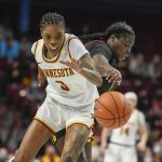 
              Maryland guard Ashley Owusu, right, knocks the ball away from Minnesota guard Deja Winters during the first half an NCAA college basketball game Sunday Jan. 9, 2022, in Minneapolis. (AP Photo/Craig Lassig)
            