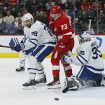 
              Detroit Red Wings left wing Adam Erne (73) can't redirect the shot against Toronto Maple Leafs defenseman TJ Brodie (78) and goaltender Petr Mrazek (35) during the first period of an NHL hockey game Saturday, Jan. 29, 2022, in Detroit. (AP Photo/Duane Burleson)
            