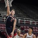 
              Arizona guard Pelle Larsson (3) shoots over Stanford forward Jaiden Delaire (11) and forward Spencer Jones (14) during the second half of an NCAA college basketball game in Stanford, Calif., Thursday, Jan. 20, 2022. (AP Photo/Jeff Chiu)
            