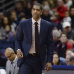 
              FILE - In this Feb. 25, 2018, file photo, Connecticut coach Kevin Ollie watches during the first half the team's NCAA college basketball game in Storrs, Conn. An independent arbiter has ruled that UConn improperly fired former men's basketball coach Kevin Ollie and must pay him more than $11 million, Ollie's lawyer said Thursday, Jan. 20, 2022. (AP Photo/Jessica Hill, File)
            