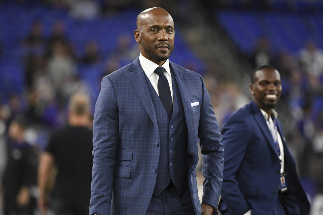 FILE - ESPN's Monday Night Football analyst Louis Riddick walks on the field during pre-game warm-u...