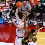 
              Wisconsin's Tyler Wahl (5) shoots against Iowa's Kris Murray (24) during the first half of an NCAA college basketball game Thursday, Jan. 6, 2022, in Madison, Wis. (AP Photo/Andy Manis)
            