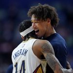 
              New Orleans Pelicans forward Brandon Ingram (14) celebrates his buzzer-beating 3-point shot with center Jaxson Hayes to defeat the Minnesota Timberwolves in the second half of an NBA basketball game in New Orleans, Tuesday, Jan. 11, 2022. The Pelicans won 128-125. (AP Photo/Gerald Herbert)
            