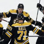 
              Boston Bruins' Taylor Hall (71) celebrates his goal with Mike Reilly (6), Erik Haula (56) and Craig Smith (12) during the first period of an NHL hockey game against the Minnesota Wild, Thursday, Jan. 6, 2022, in Boston. (AP Photo/Michael Dwyer)
            