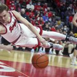 
              Rutgers forward Oskar Palmquist (1) makes a diving attempt to keep the ball in bounds during the first half of the team's NCAA college basketball game against Iowa on Wednesday, Jan. 19, 2022, in Piscataway, N.J. (Andrew Mills/NJ Advance Media via AP)
            