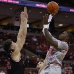 
              Ohio State's E.J. Liddell, right, shoots as IUPUI's Jonah Carrasco defends during the second half of an NCAA college basketball game Tuesday, Jan. 18, 2022, in Columbus, Ohio. (AP Photo/Jay LaPrete)
            