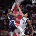 
              Houston Rockets center Christian Wood, left, shoots as Dallas Mavericks guard Josh Green defends during the first half of an NBA basketball game Friday, Jan. 7, 2022, in Houston. (AP Photo/Eric Christian Smith)
            