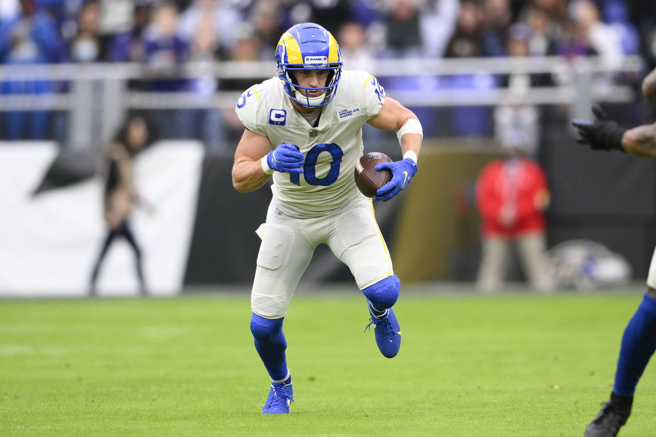 Los Angeles Rams wide receiver Cooper Kupp runs with the ball after making a catch against the Balt...