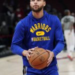 
              Golden State Warriors guard Stephen Curry warms up before an NBA basketball game against the Chicago Bulls in Chicago, Friday, Jan. 14, 2022. (AP Photo/Nam Y. Huh)
            