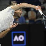 
              Alexander Zverev of Germany serves to John Millman of Australia during their second round match at the Australian Open tennis championships in Melbourne, Australia, Wednesday, Jan. 19, 2022. (AP Photo/Andy Brownbill)
            