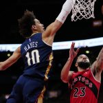 
              Toronto Raptors guard Fred VanVleet (23) goes for a layup as New Orleans Pelicans center Jaxson Hayes (10) defends during second-half NBA basketball game action in Toronto, Sunday, Jan. 9, 2022. (Frank Gunn/The Canadian Press via AP)
            